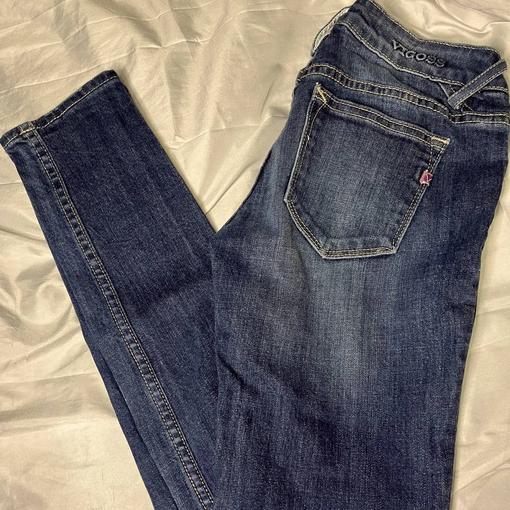 Dark, distressed wash Vigoss skinny jeans.
